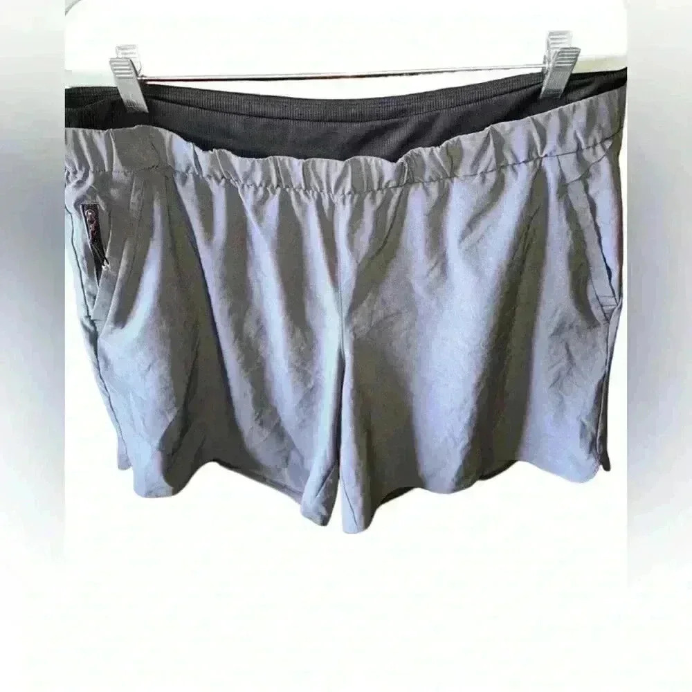 Men’s Xl gray running shorts with built in black briefs. Quick dry. Zip pocket.